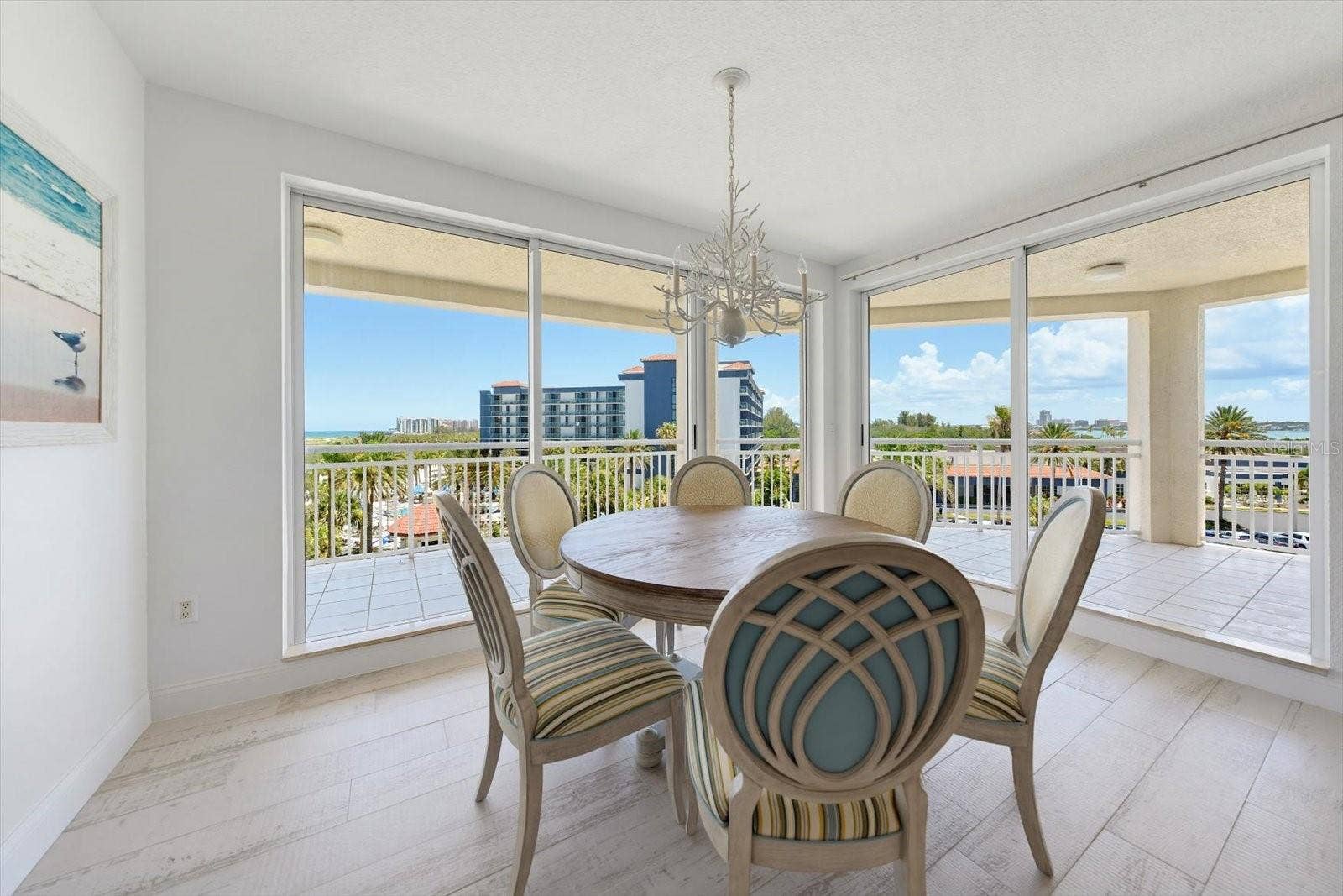 1170 GULF BOULEVARD, #404, Clearwater Beach, FL 33767 Spacious dining room with adjacent balcony offers the opportunity to dine & step outside for a relaxing sunset afterwrds.