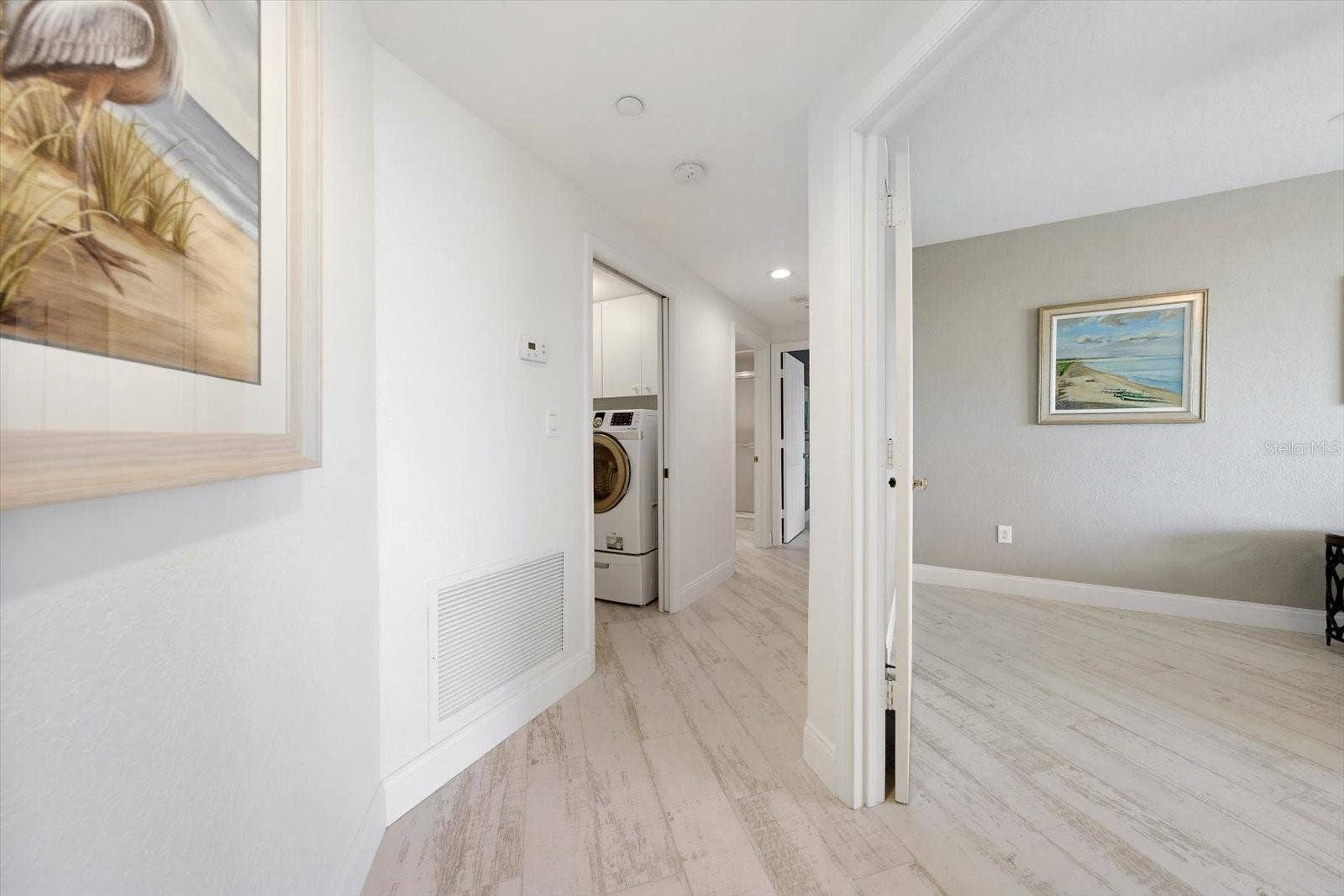 1170 GULF BOULEVARD, #404, Clearwater Beach, FL 33767 Hallway-The custom tiles flooring gives the appearance of beach wood for that coastal touch.