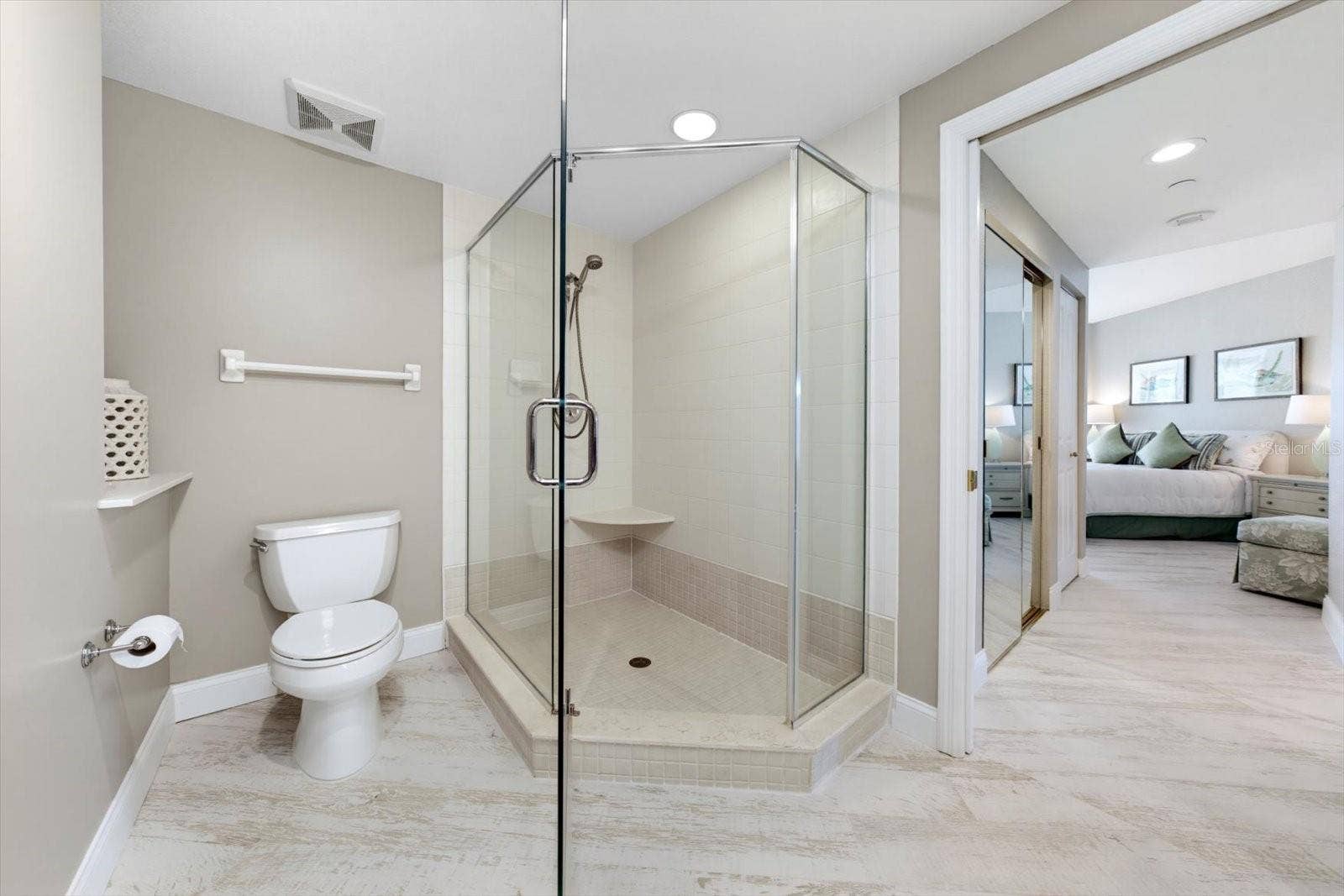 1170 GULF BOULEVARD, #404, Clearwater Beach, FL 33767 This generously spaced primary bathroom could be your next hideaway from it all. This exquisite shower welcomes you for a few moments of relaxation.