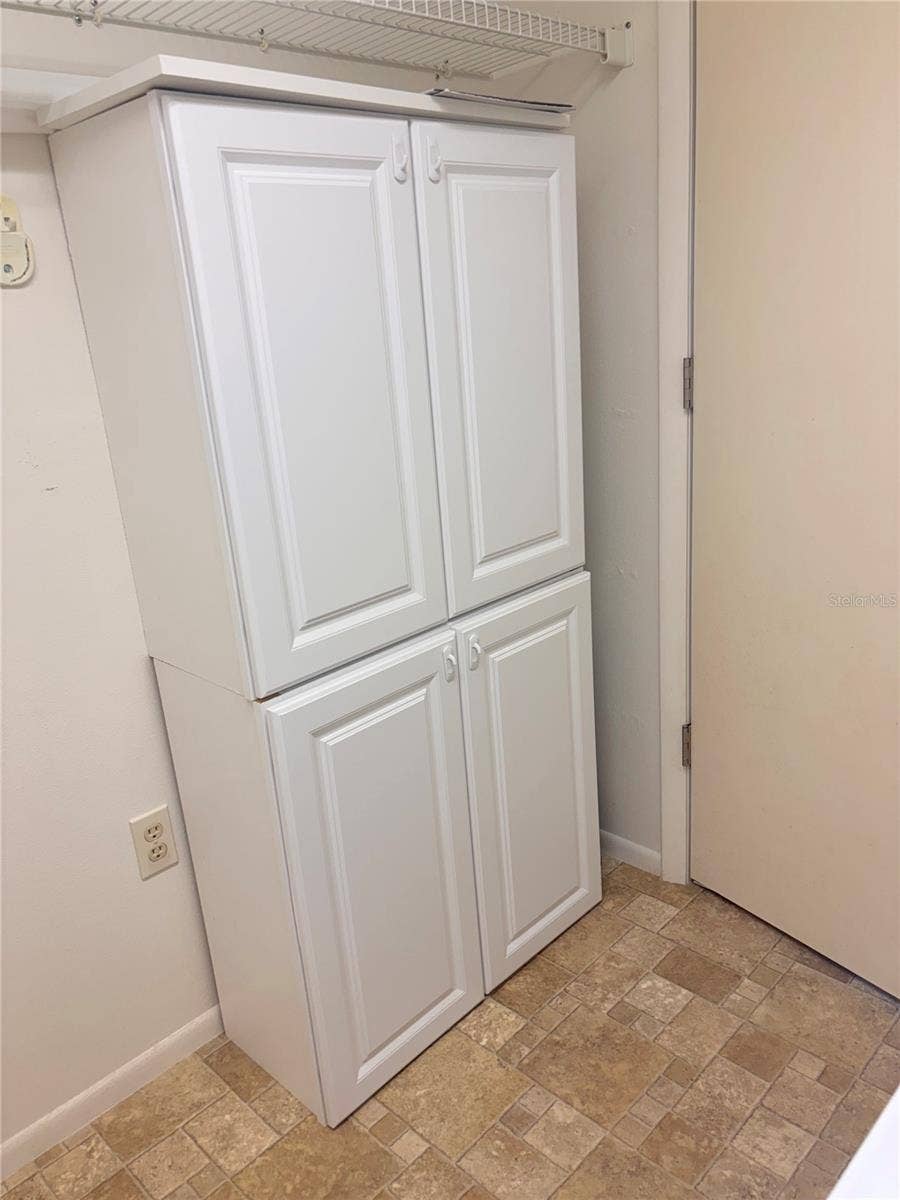 4460 FAIRWAYS BOULEVARD, #407, Bradenton, FL 34209 Cabinet in Laundry Room