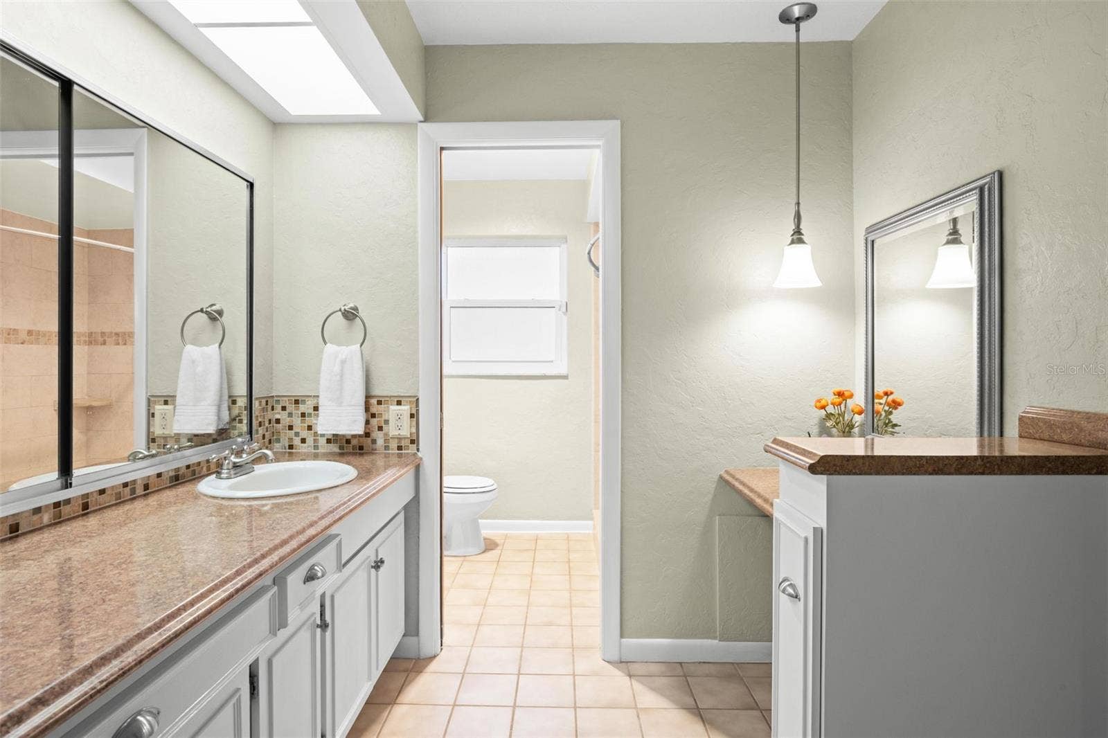 Primary bathroom and make up vanity