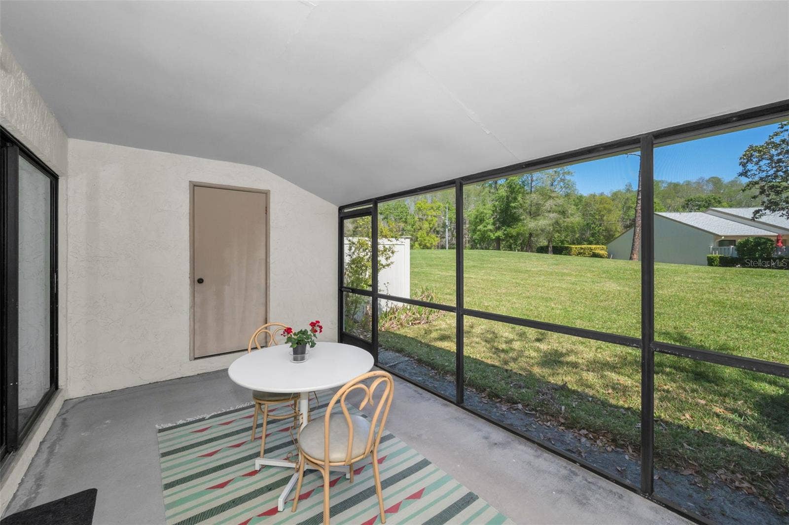 1333 SHADY PINE WAY, #F, Tarpon Springs, FL 34688 Screened-In Patio With Storage Closet