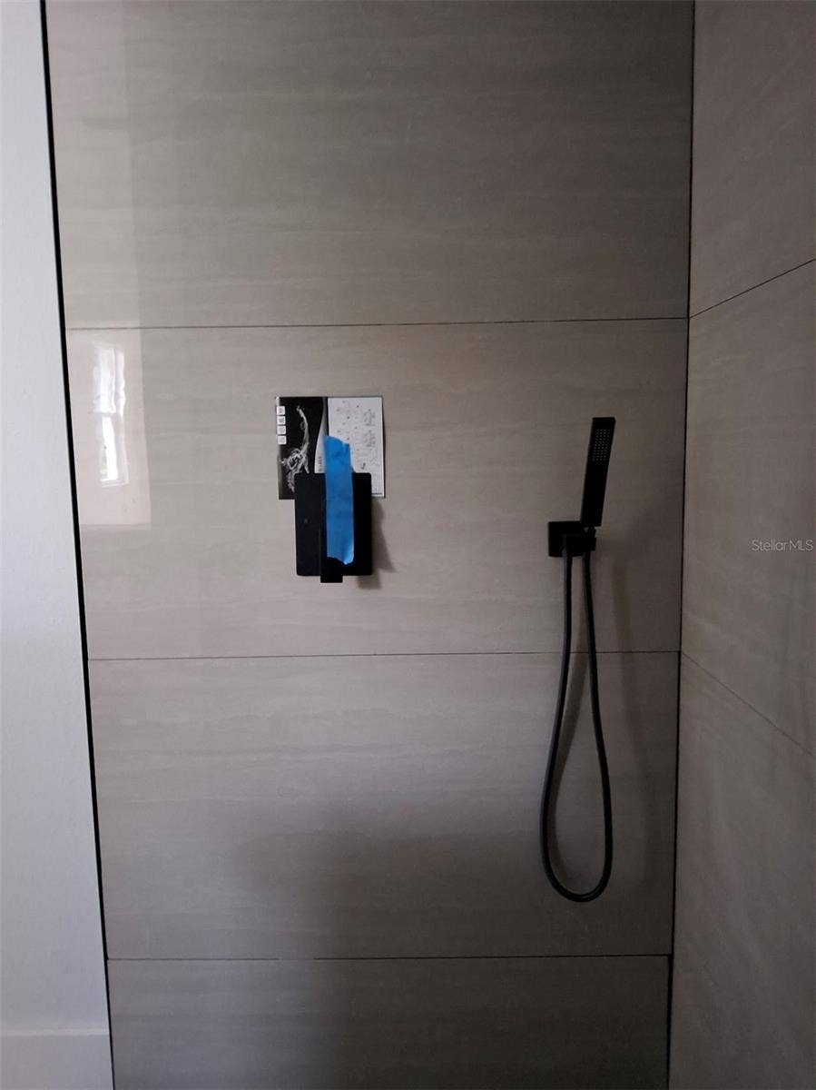 large walk in shower with built in bench