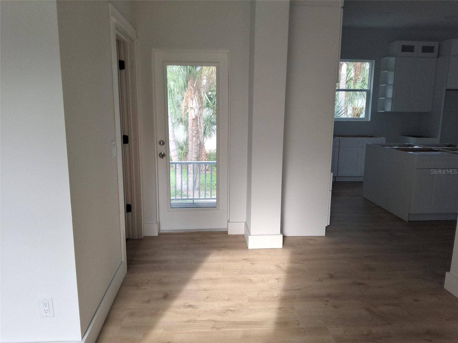 Back door off kitchen near office area and powder bath