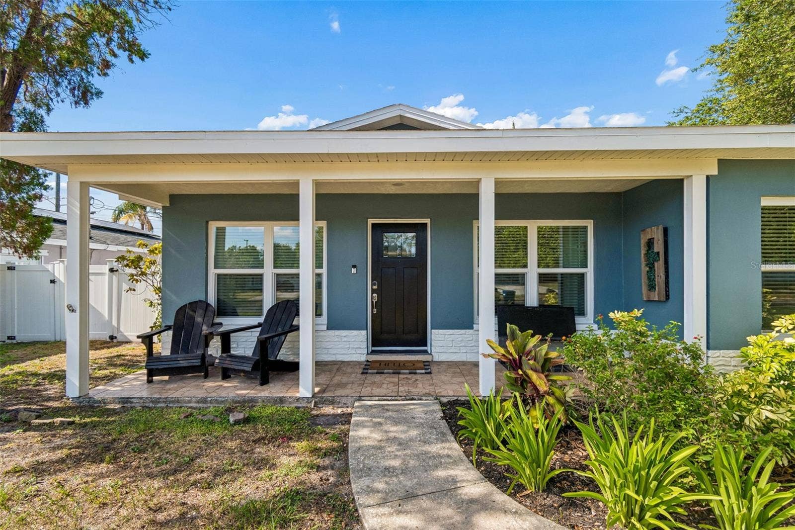 A welcoming covered front porch adds to the charm of this Seminole home.