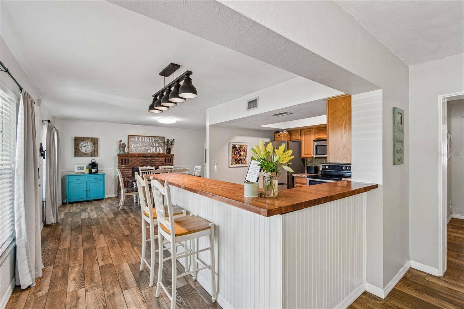 The kitchen opens to the surrounding living areas, keeping everyone connected.