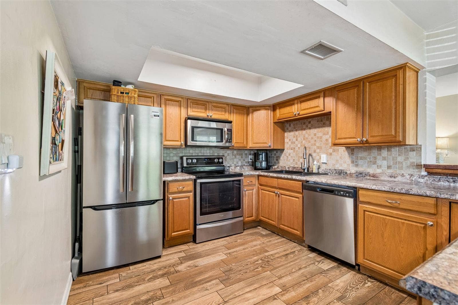 Plenty of cabinet and counter space plus stainless steel appliances make this kitchen ready for everyday life.