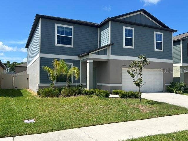 22164 N CALISTO WAY N, Land O Lakes, FL 34637 FRONT EXTERIOR w/ PVC PRIVACY FENCE
