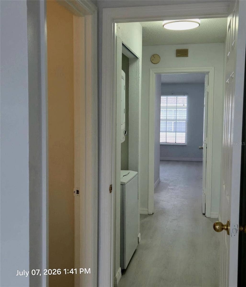 734 KENSINGTON LAKE CIR, #BRANDON, Brandon, FL 33511 Laundry Leading to Bedroom