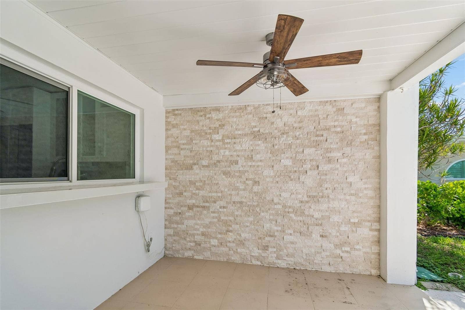775 CAPRI BOULEVARD, Treasure Island, FL 33706 Convenient covered patio with pass through kitchen window