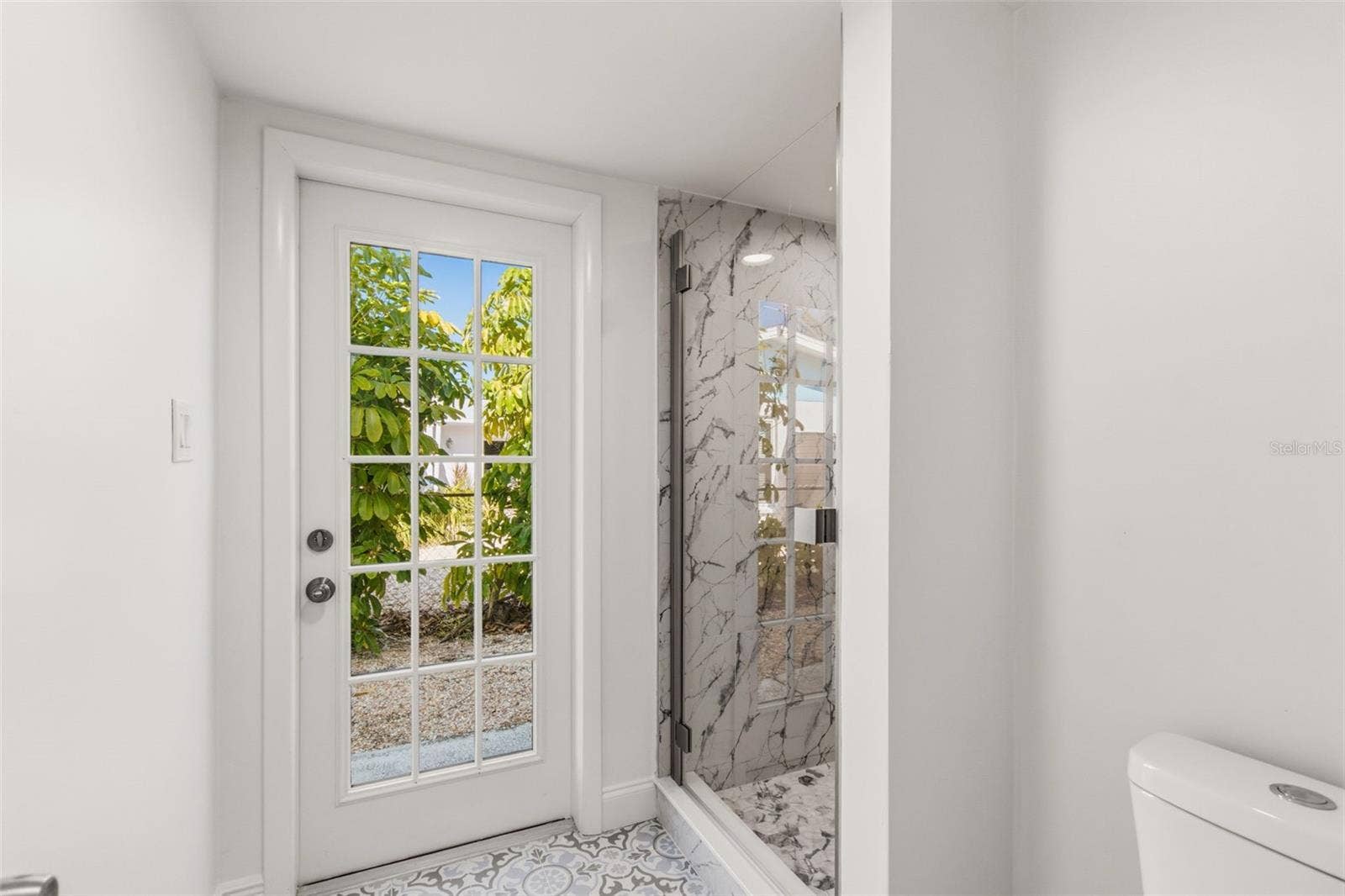 775 CAPRI BOULEVARD, Treasure Island, FL 33706 Pool guest can use this side door to access the bathroom