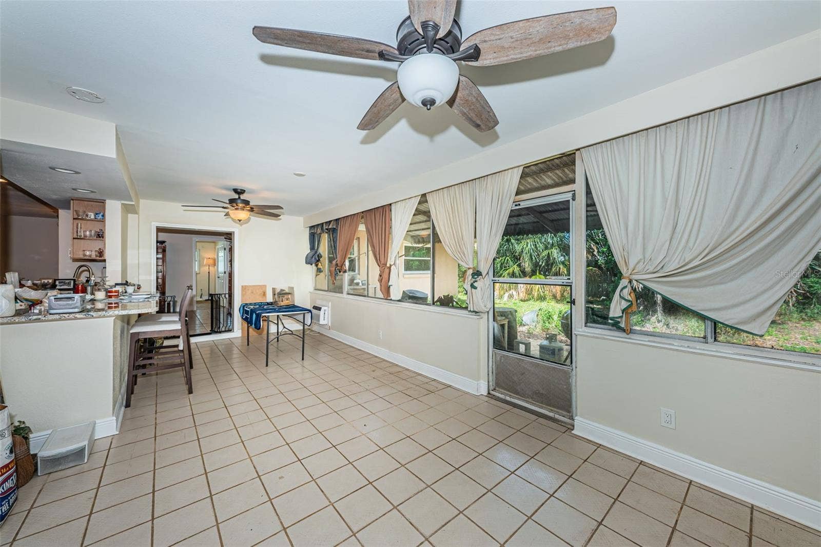 5230 VENETIAN BOULEVARD NE, St Petersburg, FL 33703 Screened in room expands the square footage to 2,187