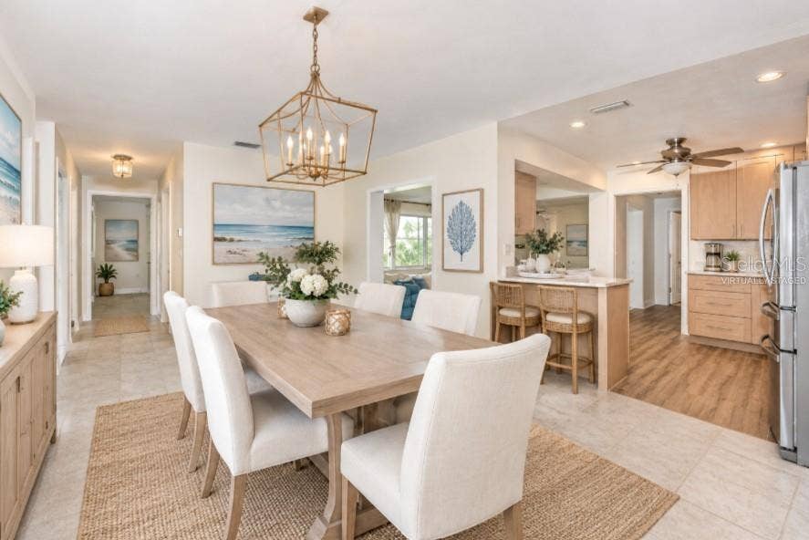 5230 VENETIAN BOULEVARD NE, St Petersburg, FL 33703 Virtually staged dining room connected to kitchen
