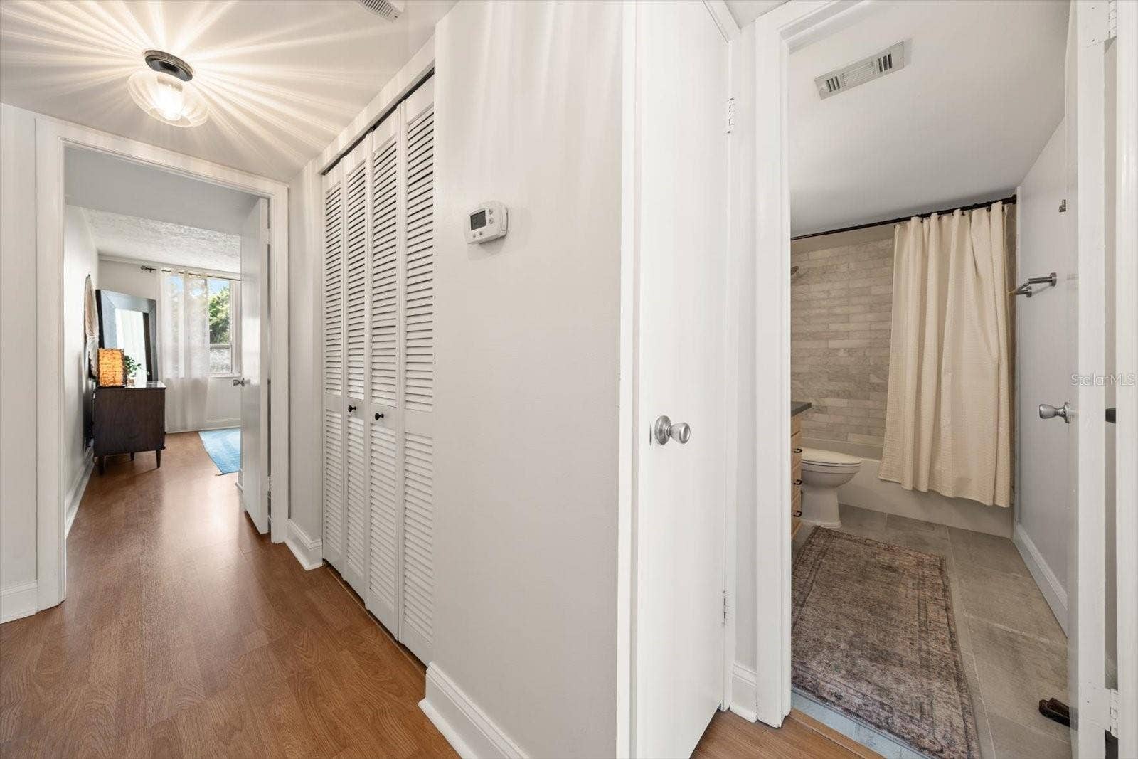2614 COVE CAY DRIVE, #409, Clearwater, FL 33760 Hallway with linen closet outside of 2nd bath.