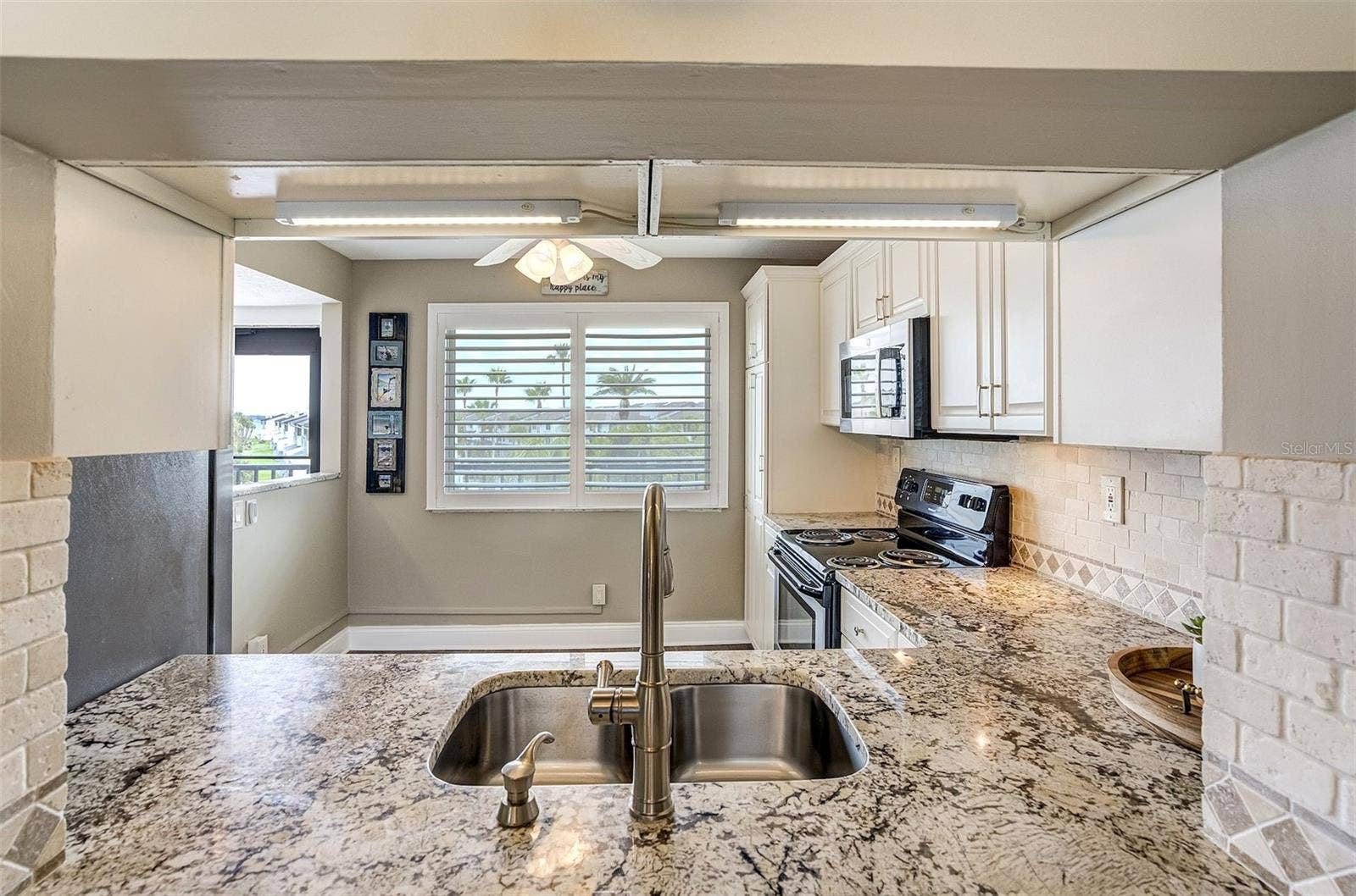 1581 GULF BOULEVARD, #203N, Clearwater Beach, FL 33767 Natural Light Flowing In Kitchen