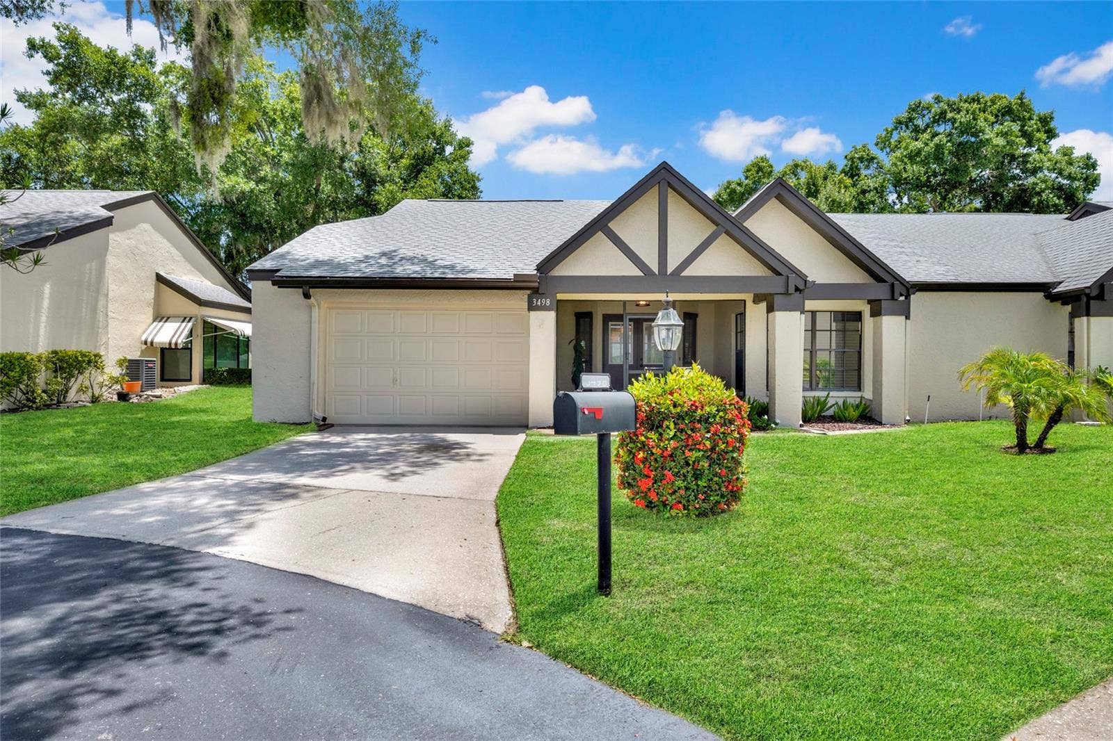 3498 E WOODMONT WAY, Palm Harbor, FL 34684 Front of Home with Bushes