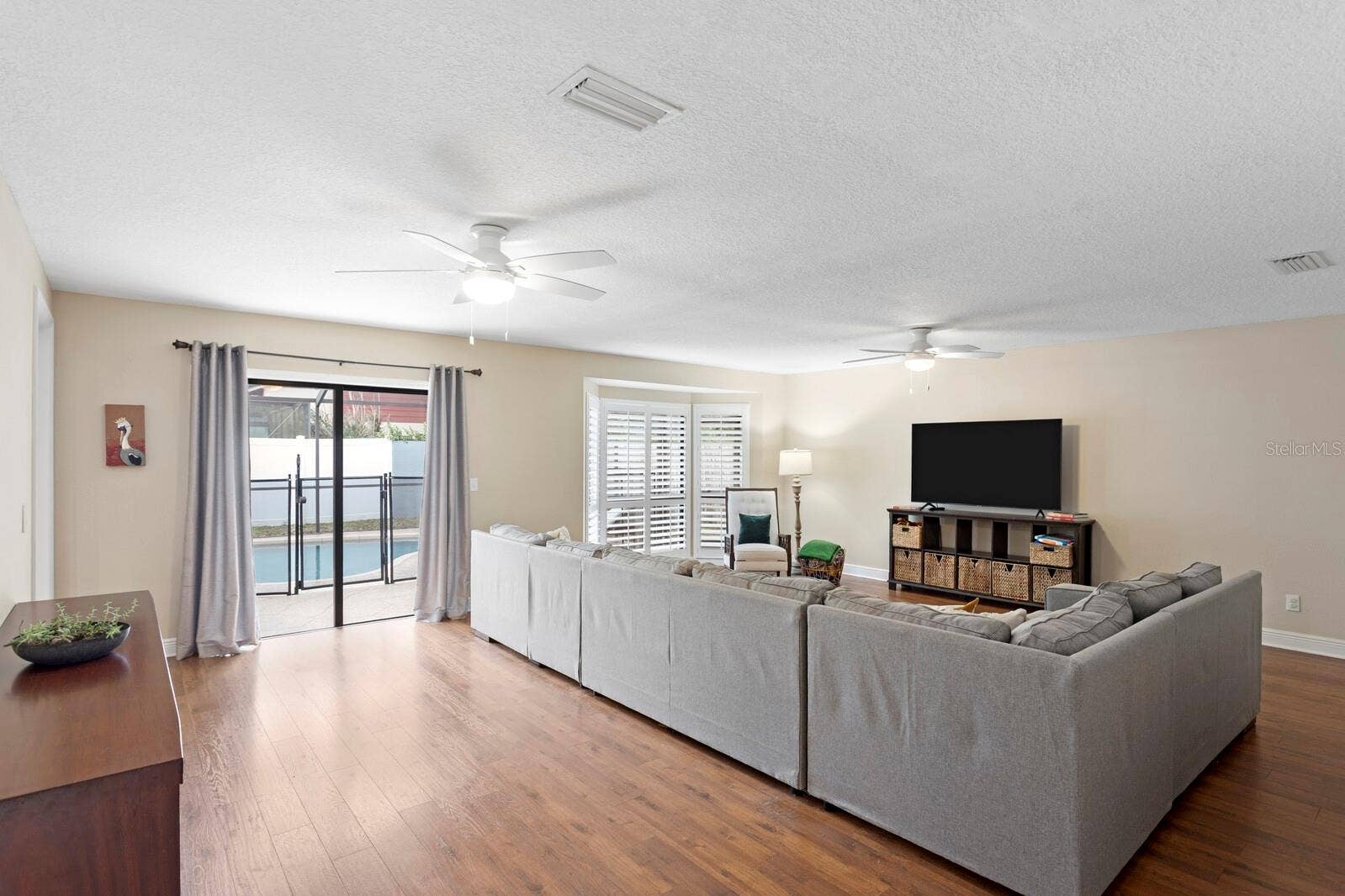 12803 RAIN FOREST STREET, Temple Terrace, FL 33617 These Floors are Beautiful! Enjoy Pool and Patio Views from Your Media Room