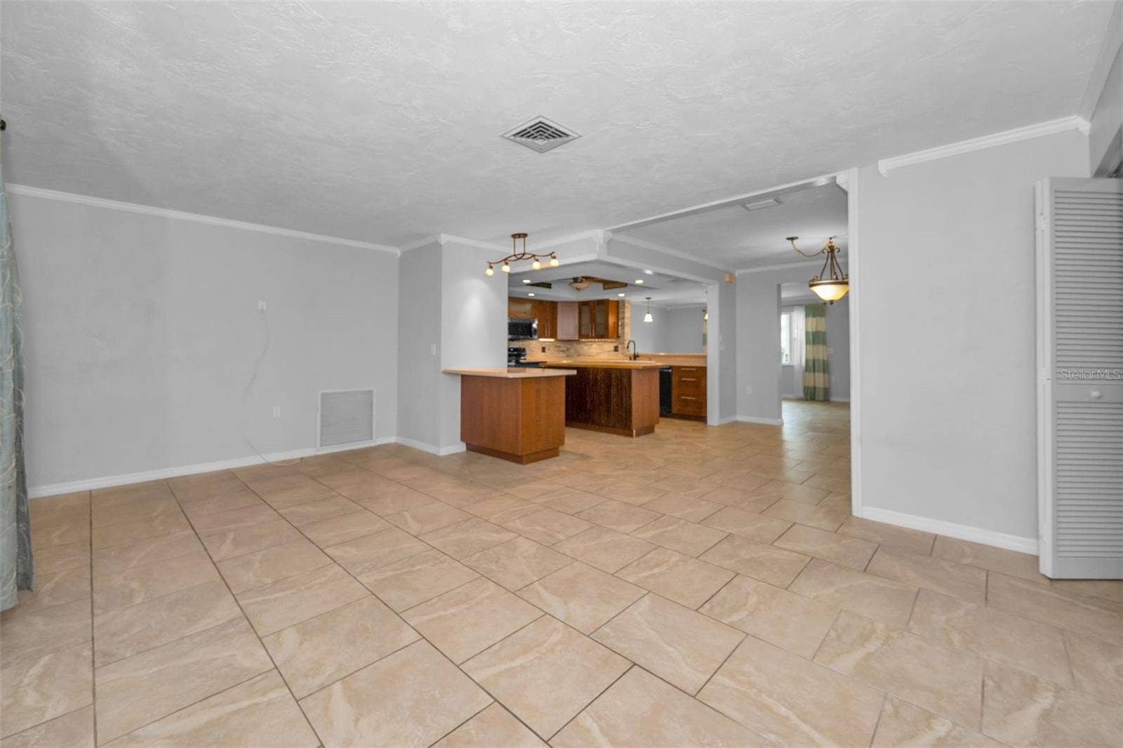 13760 87TH PLACE, Seminole, FL 33776 Living Room looking into the Kitchen