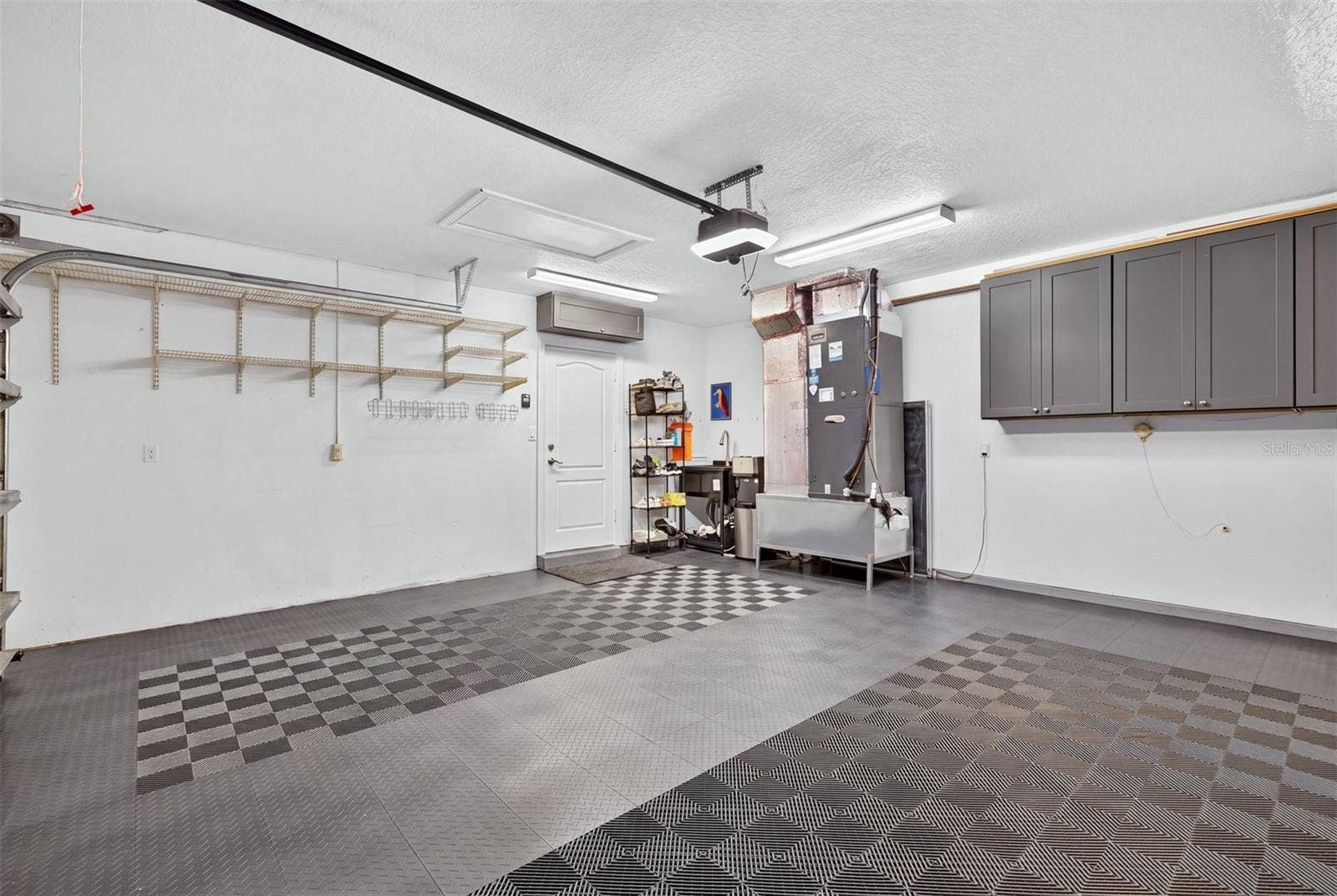 Garage with sink and HVAC relocated