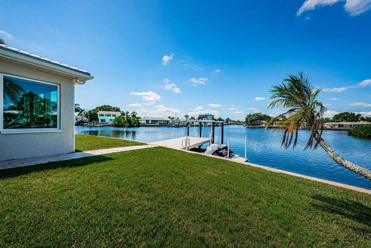 4280 13TH LANE NE, St Petersburg, FL 33703 Beautiful wide open water view with dock, hefty boat lift and floating dock