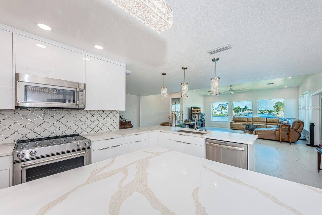 4280 13TH LANE NE, St Petersburg, FL 33703 Lots of counter space with beautiful toe kick lighting and modern remote-controlled lighting