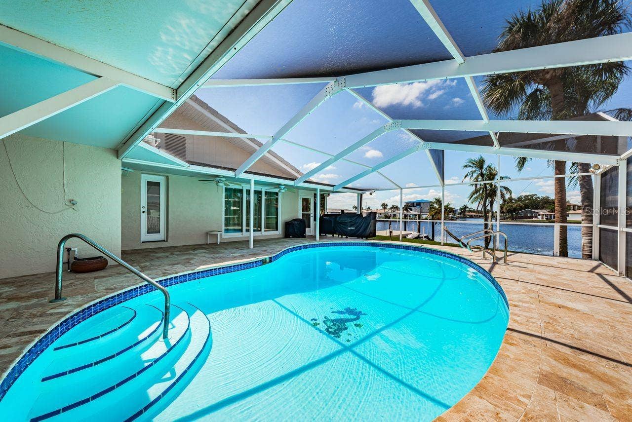 4280 13TH LANE NE, St Petersburg, FL 33703 Multiple shady spaces to enjoy the pool