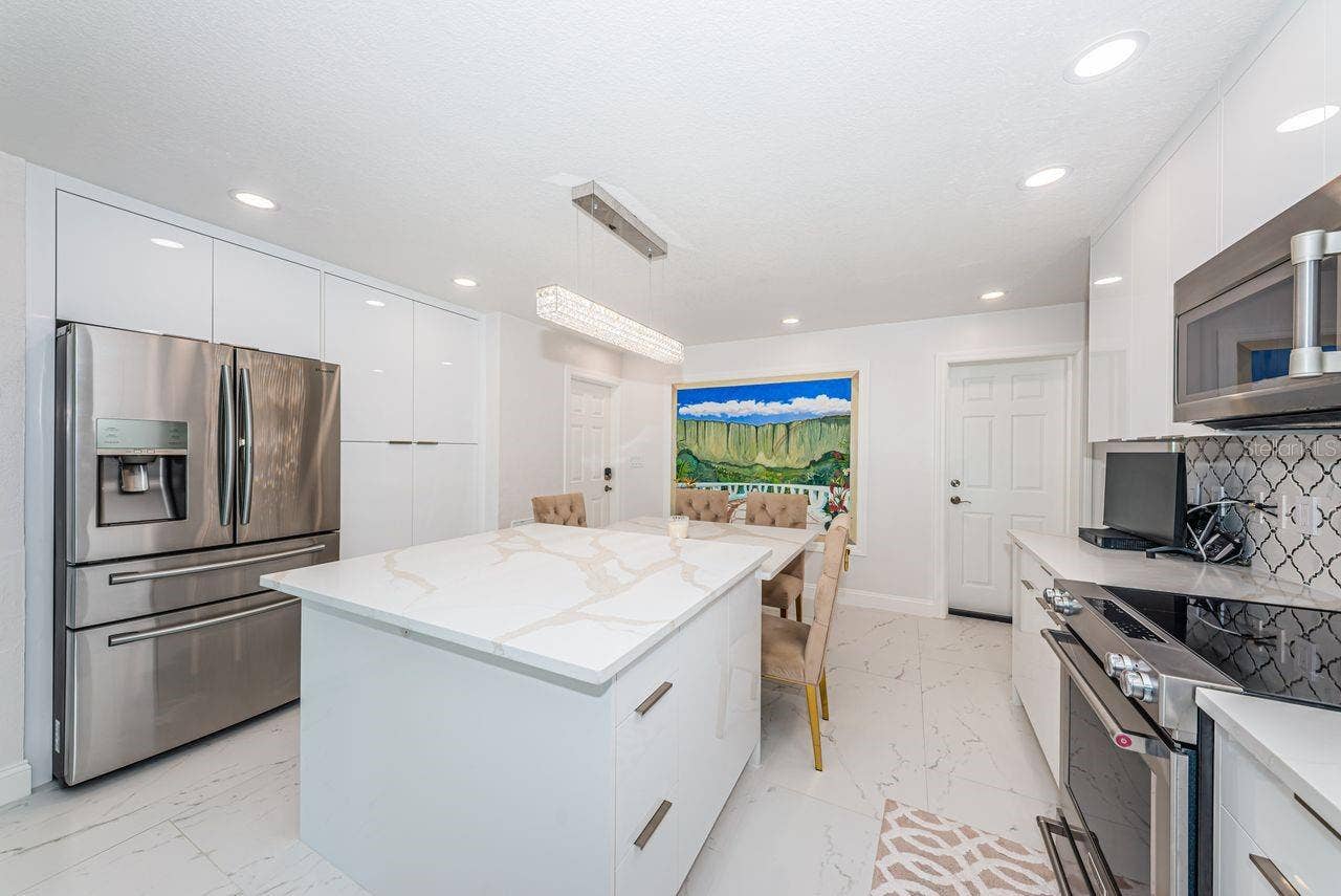4280 13TH LANE NE, St Petersburg, FL 33703 Beautiful quartz island with deep soft close drawers and charging outlets