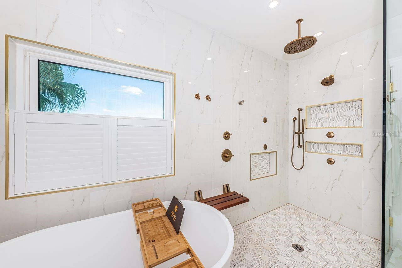 4280 13TH LANE NE, St Petersburg, FL 33703 Tub with large modern shower and natural lighting