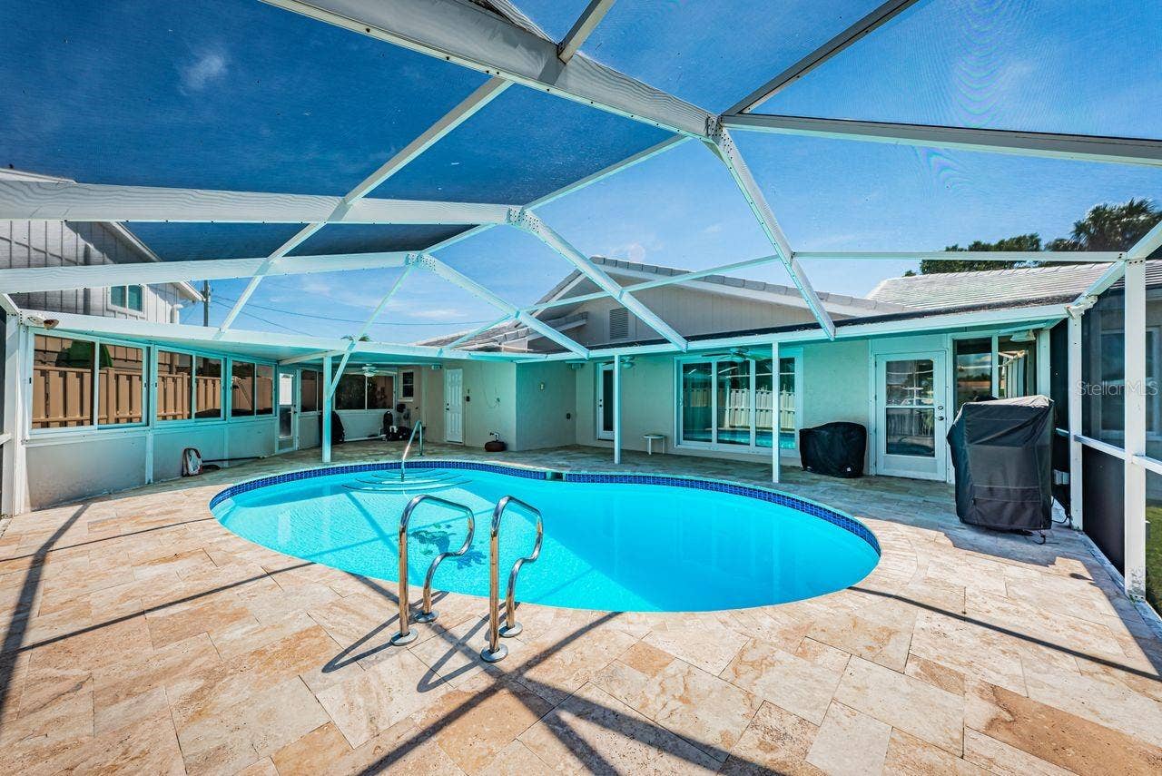 4280 13TH LANE NE, St Petersburg, FL 33703 Pool enclosure keeps the pool clean