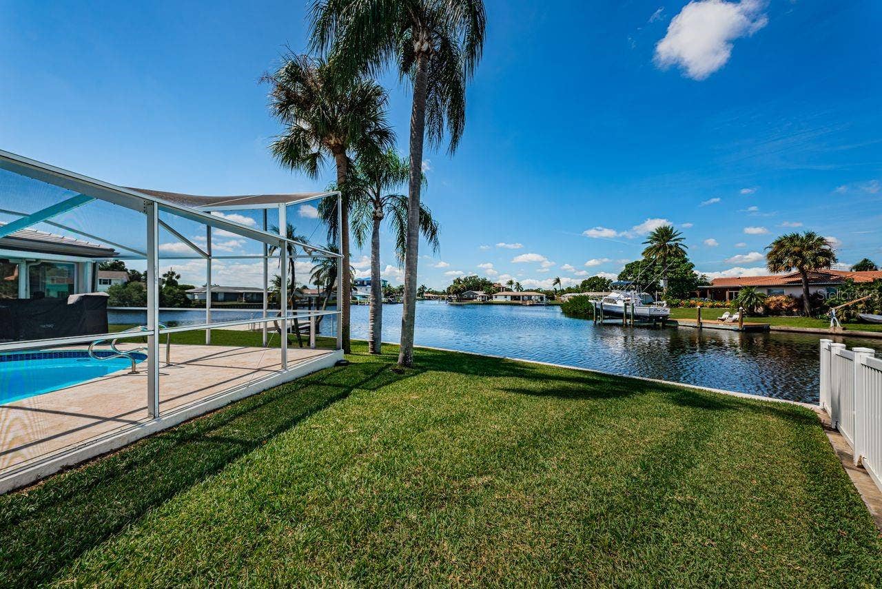 4280 13TH LANE NE, St Petersburg, FL 33703 Big side yard for pets. Pool door leads outside