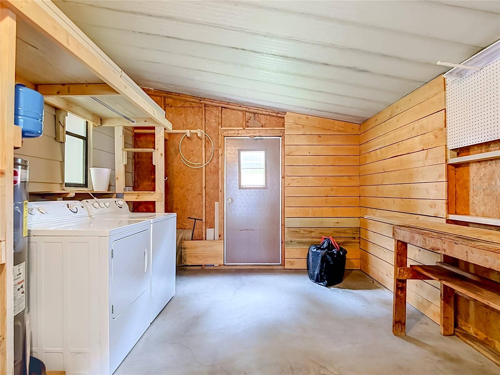 4919 BLANCO DRIVE, Zephyrhills, FL 33541 Outdoor Laundry/Storage Area