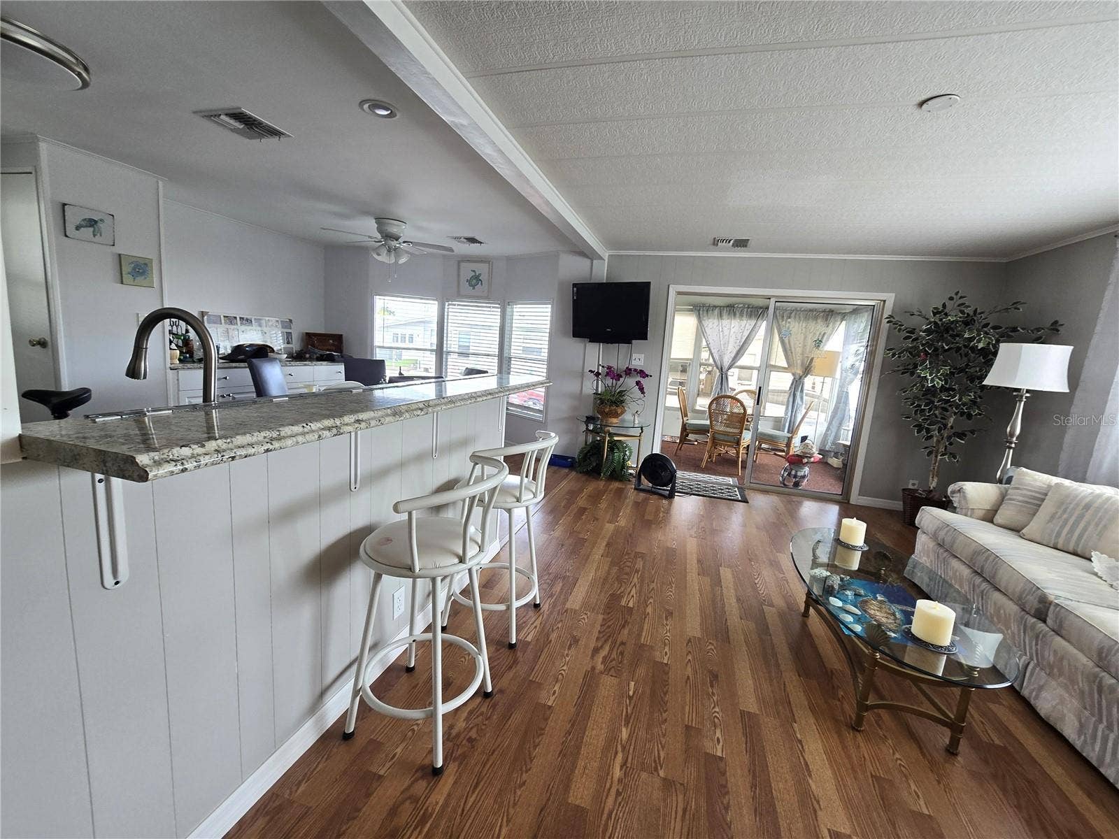 2122 WATERVIEW DRIVE, Holiday, FL 34691 From living room towards front enclosed porch