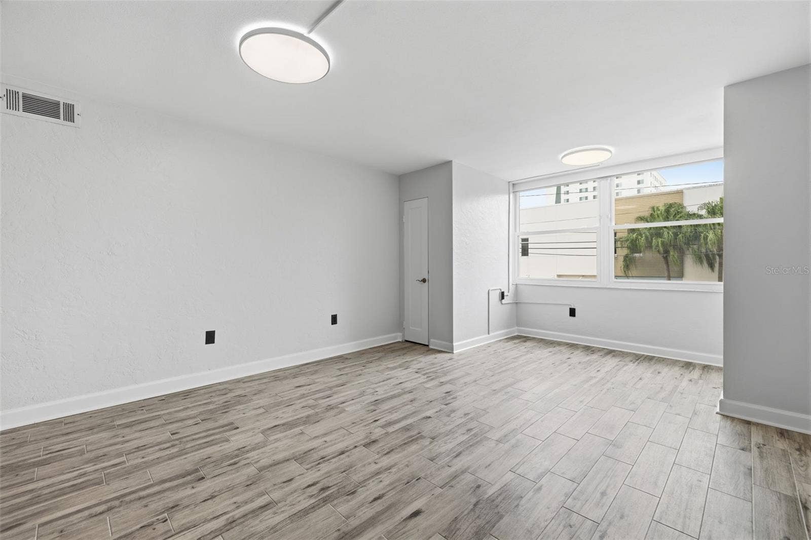 841 4TH AVENUE N, #27, St Petersburg, FL 33701 Fresh paint, new flooring, updated doors and hardware create a clean, cohesive feel throughout the home.