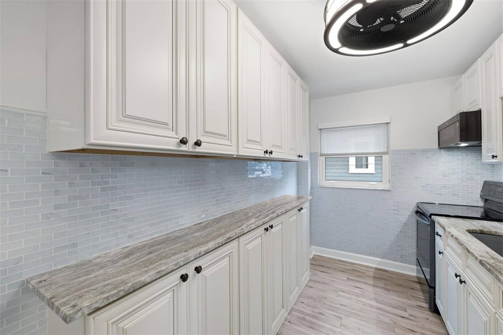 841 4TH AVENUE N, #27, St Petersburg, FL 33701 Bright, updated kitchen with abundant cabinetry and counter space for everyday cooking and storage.