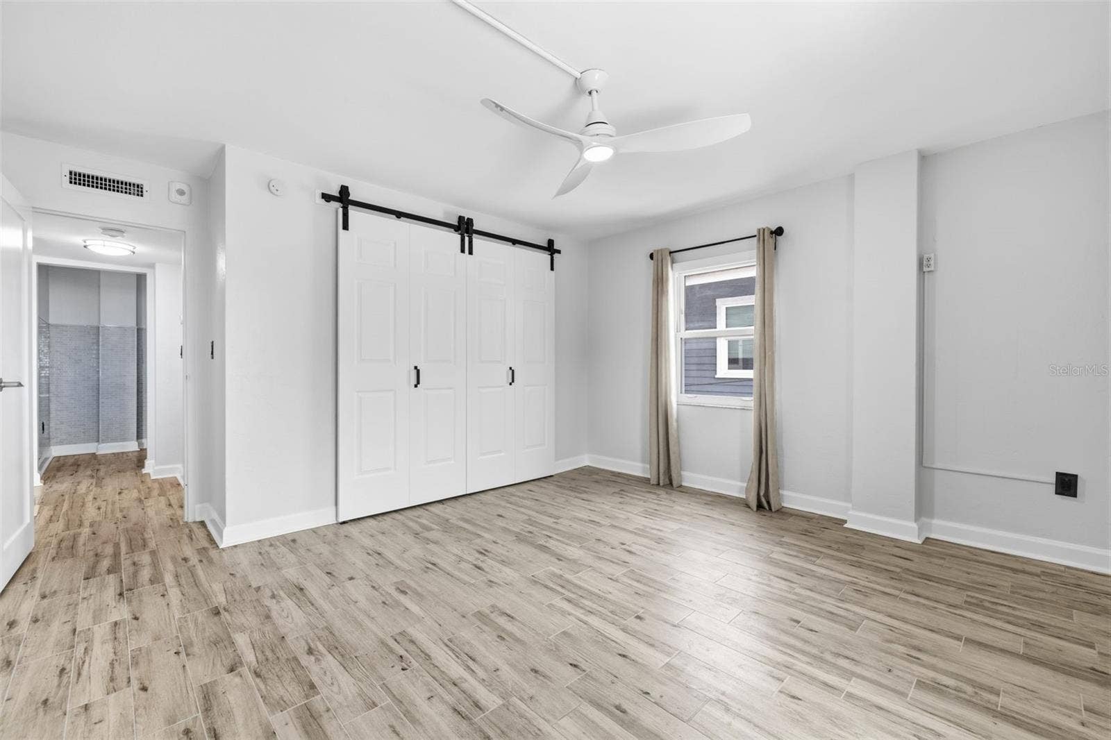 841 4TH AVENUE N, #27, St Petersburg, FL 33701 Bright primary bedroom with plenty of space for a full bedroom suite and additional furnishings.