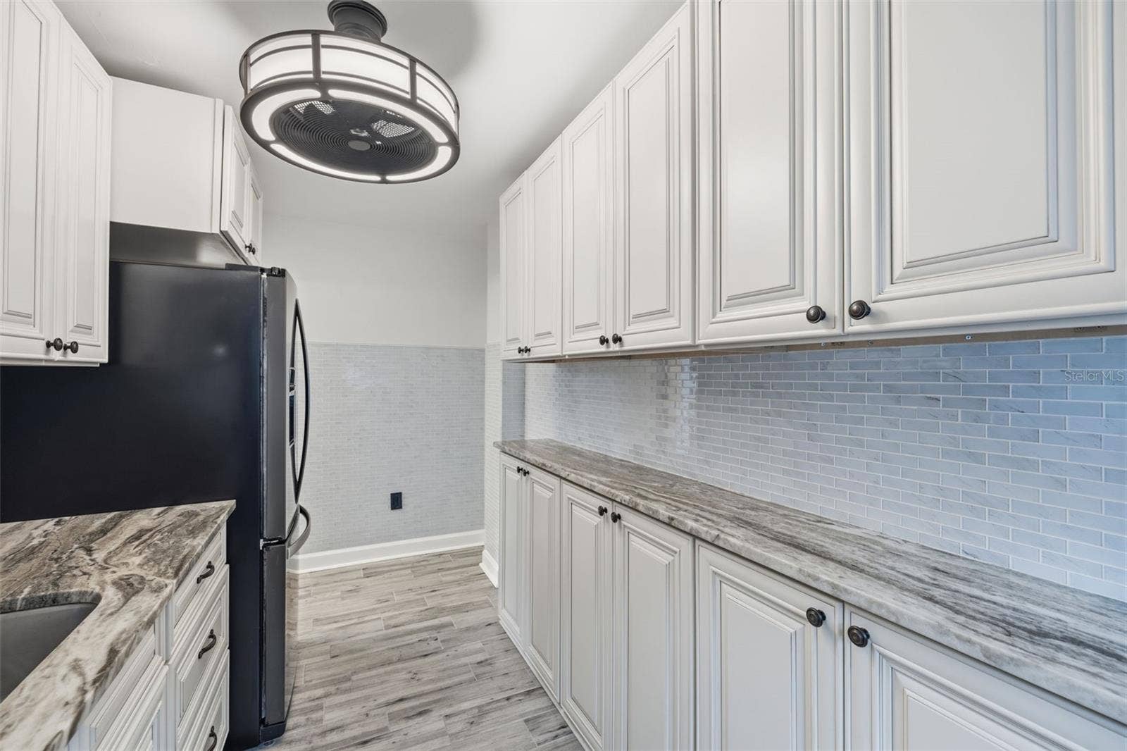 841 4TH AVENUE N, #27, St Petersburg, FL 33701 Another view of the kitchen showcasing the ample cabinet storage and counter space.