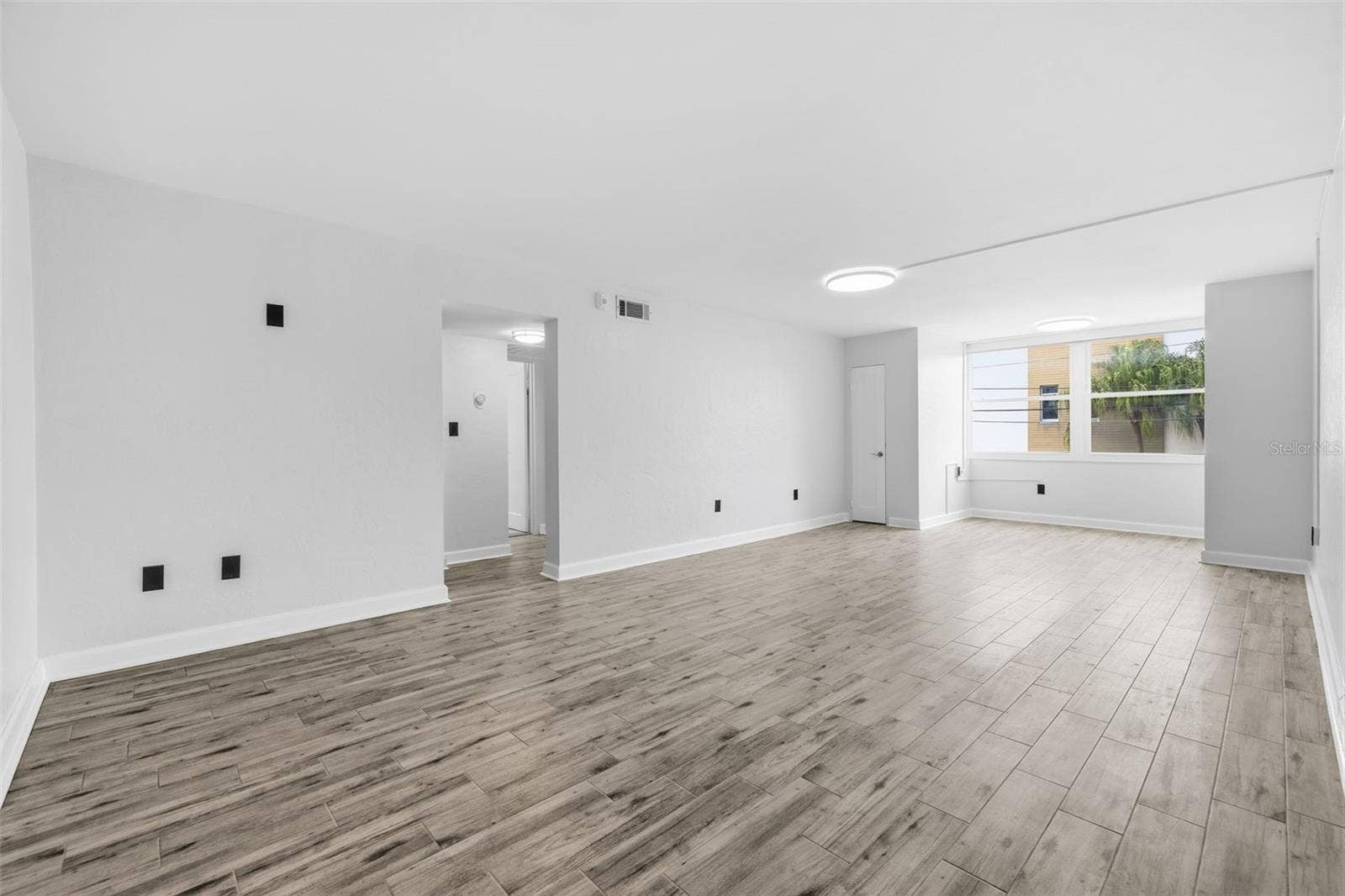 841 4TH AVENUE N, #27, St Petersburg, FL 33701 Step inside to a bright, freshly updated interior with new tile flooring and a spacious open living area.
