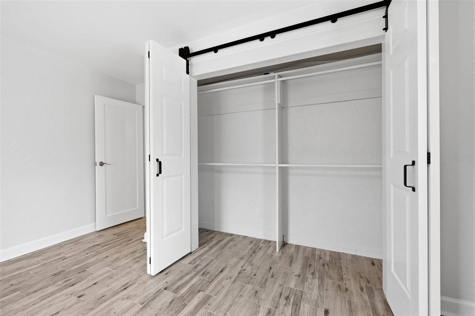 841 4TH AVENUE N, #27, St Petersburg, FL 33701 Generous closet space provides convenient storage within the primary bedroom.
