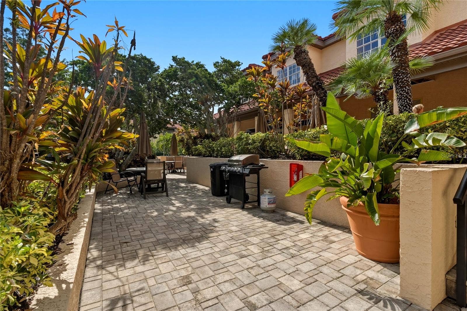 2400 FEATHER SOUND DRIVE, #427, Clearwater, FL 33762 Grills by the Pool and Clubhouse Area.
