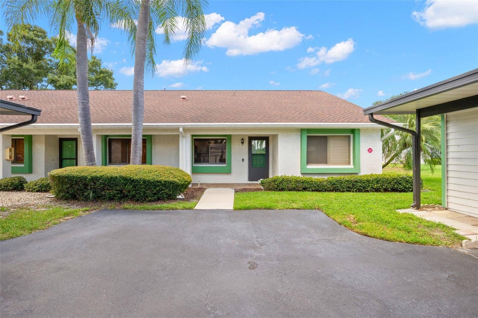 End unit villa, with carport steps from front door.