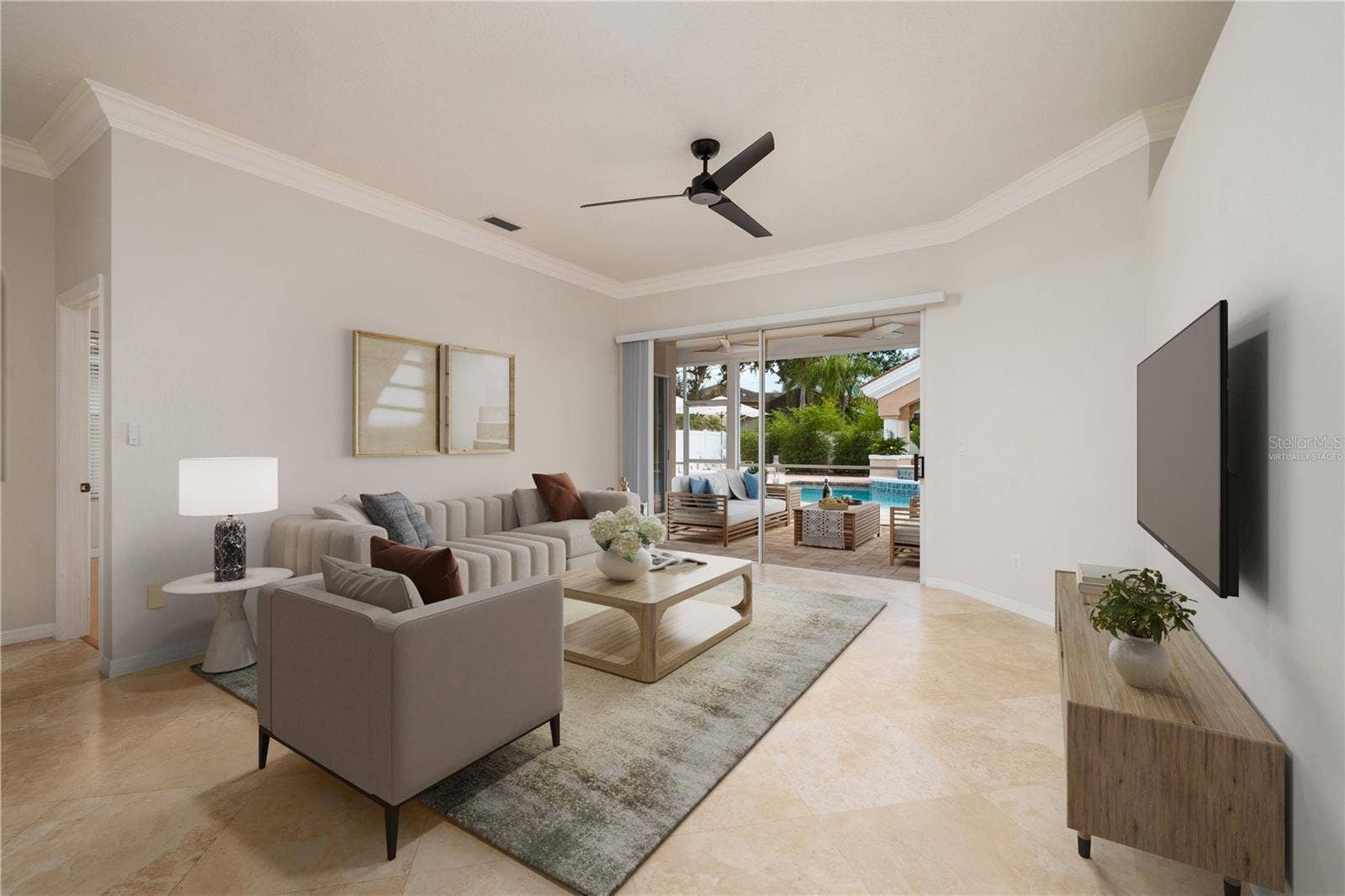 Virtually staged living room that overlooks sparkling pool