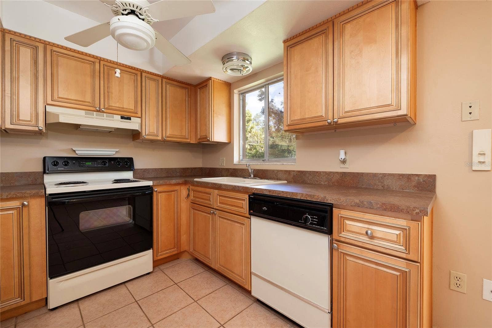 6355 102ND TERRACE N, Pinellas Park, FL 33782 Kitchen with updated solid-wood cabinets