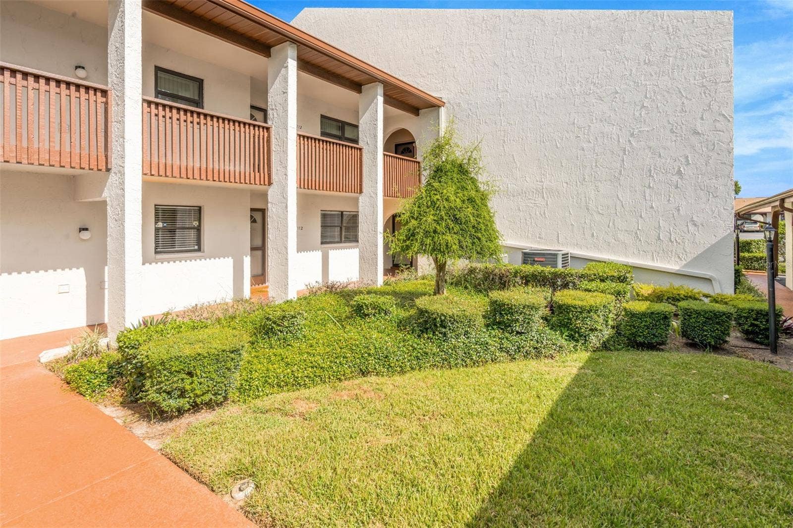 7614 RADCLIFFE CIRCLE, #B113, Port Richey, FL 34668 7614 Radcliffe Cir B113 Front of building