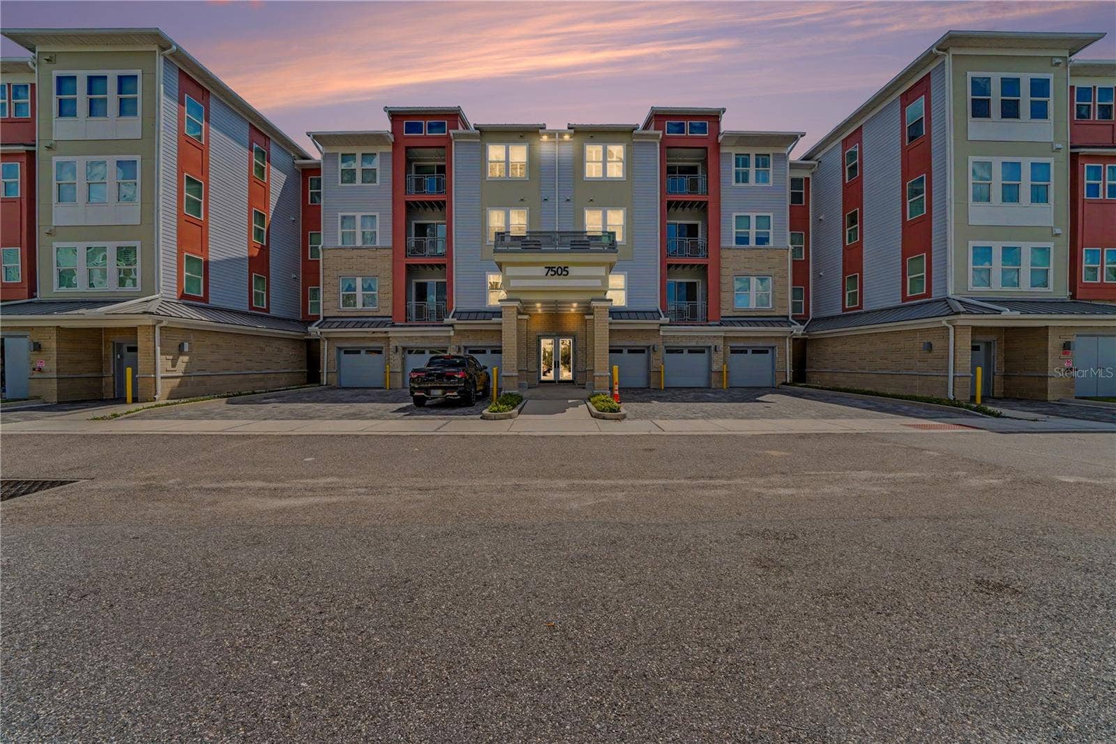 7505 LAUREATE BOULEVARD, #2407, Orlando, FL 32827 Evening photo of building