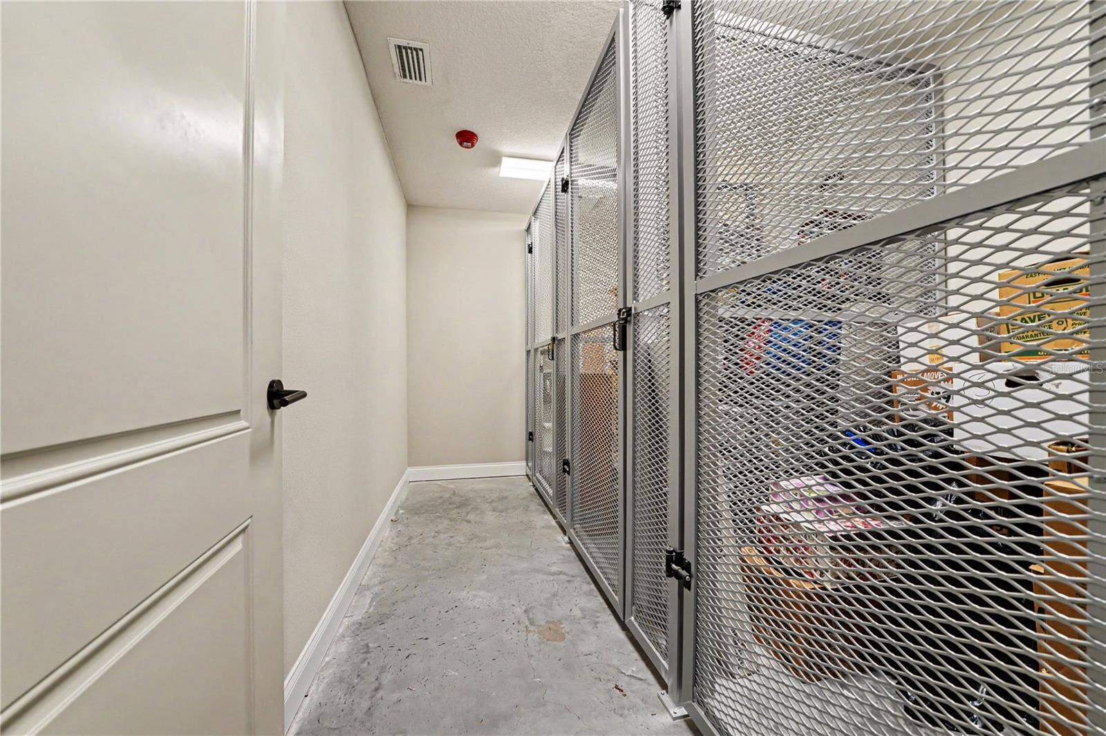 7505 LAUREATE BOULEVARD, #2407, Orlando, FL 32827 Private storage unit (first one at the end/left side of photo). Located adjacent to garage entrance
