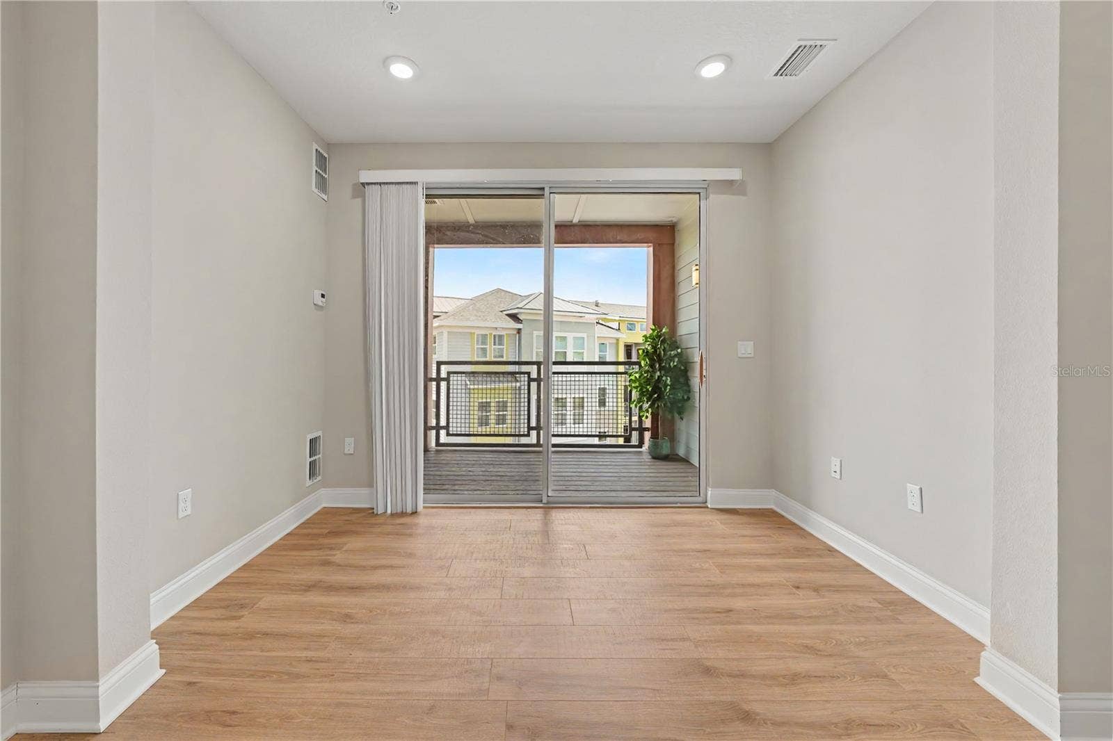 7505 LAUREATE BOULEVARD, #2407, Orlando, FL 32827 Additional area extending from the Great room with access to your balcony. Extra storage room with shelving and the perfect end unit location to enjoy sunrises each day