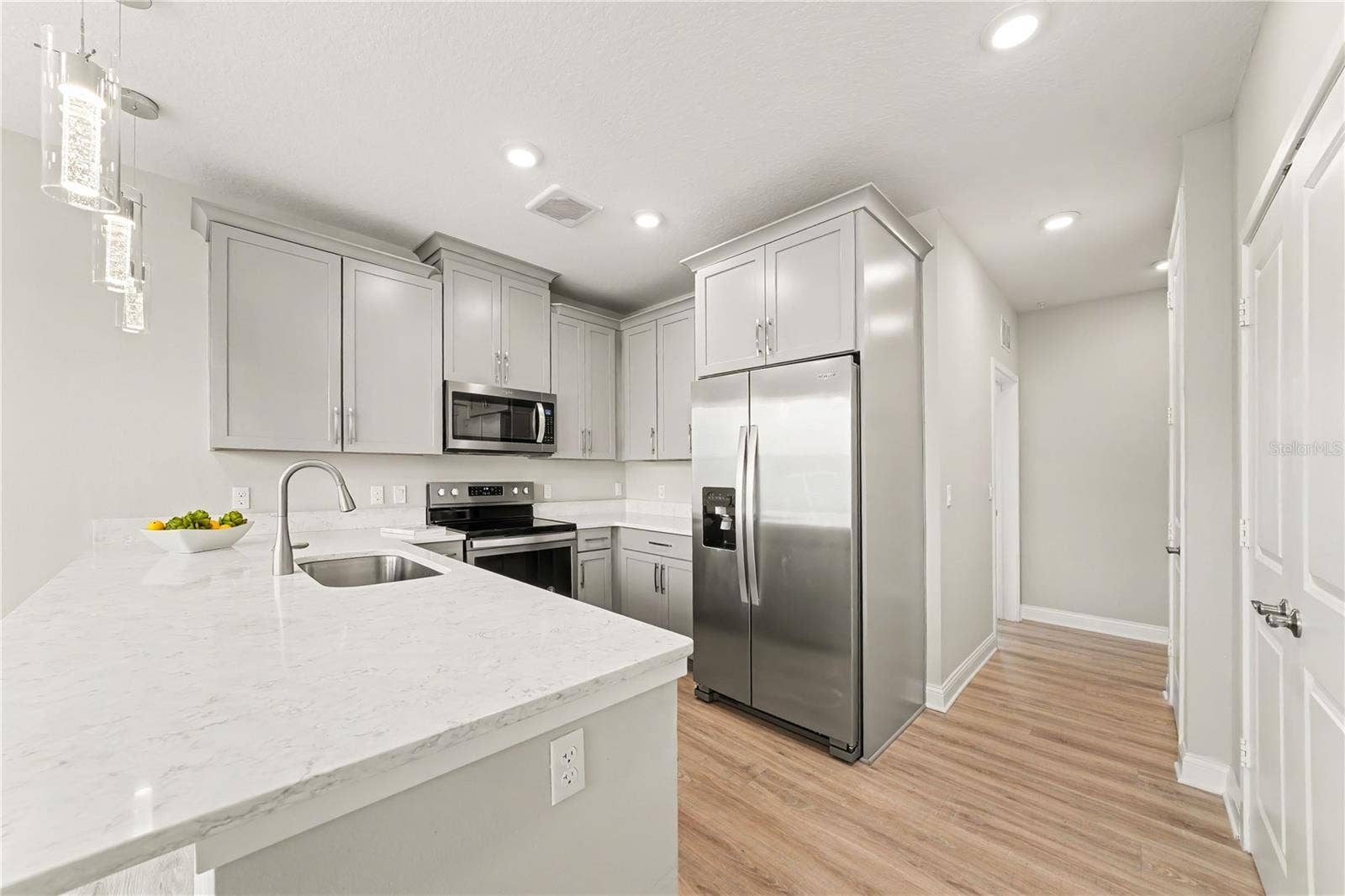 7505 LAUREATE BOULEVARD, #2407, Orlando, FL 32827 An enviable kitchen with pantry and plenty of cabinets (also with pull out shelving)
