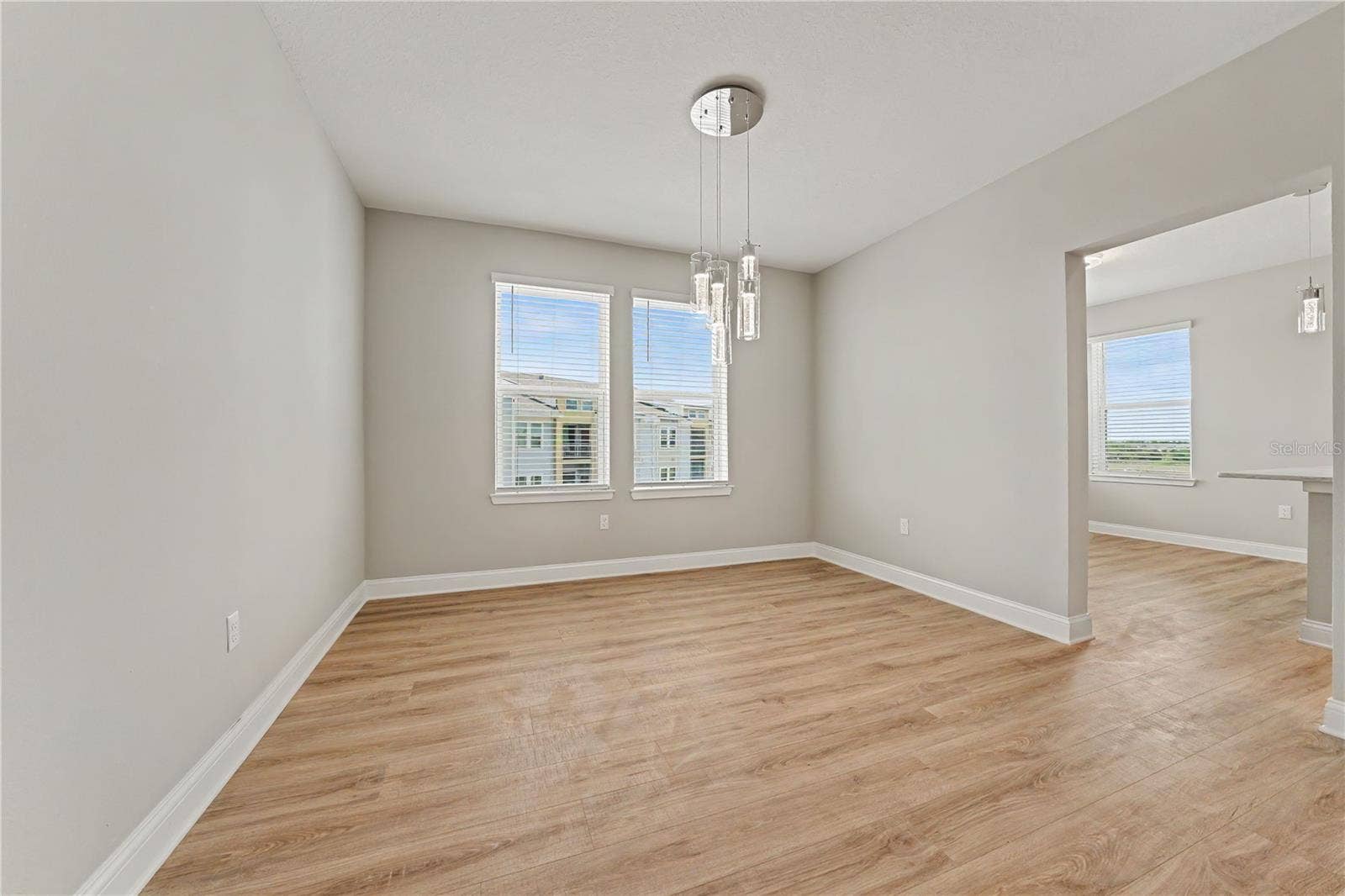 7505 LAUREATE BOULEVARD, #2407, Orlando, FL 32827 Separate dining room with stunning chandelier, adjacent to kitchen and great room.
