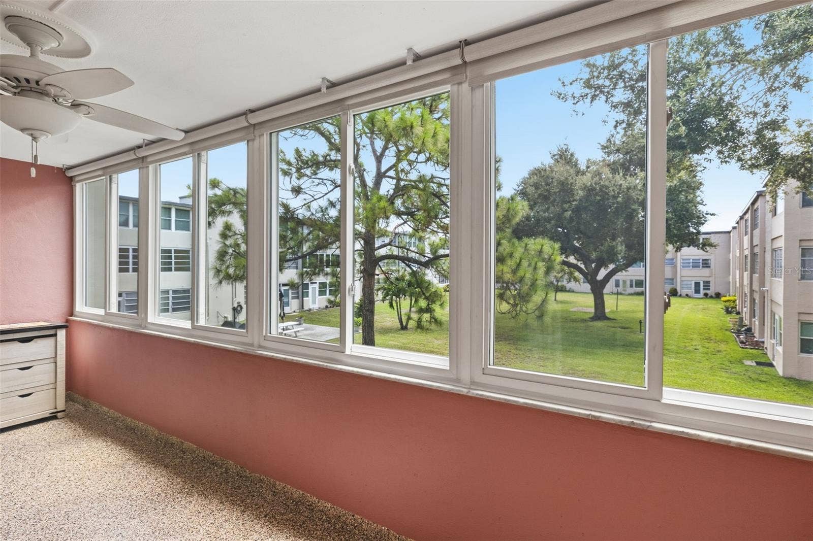 9940 47TH AVENUE N, #216, St Petersburg, FL 33708 Great View of Nature Through Impact Windows In Florida Room.