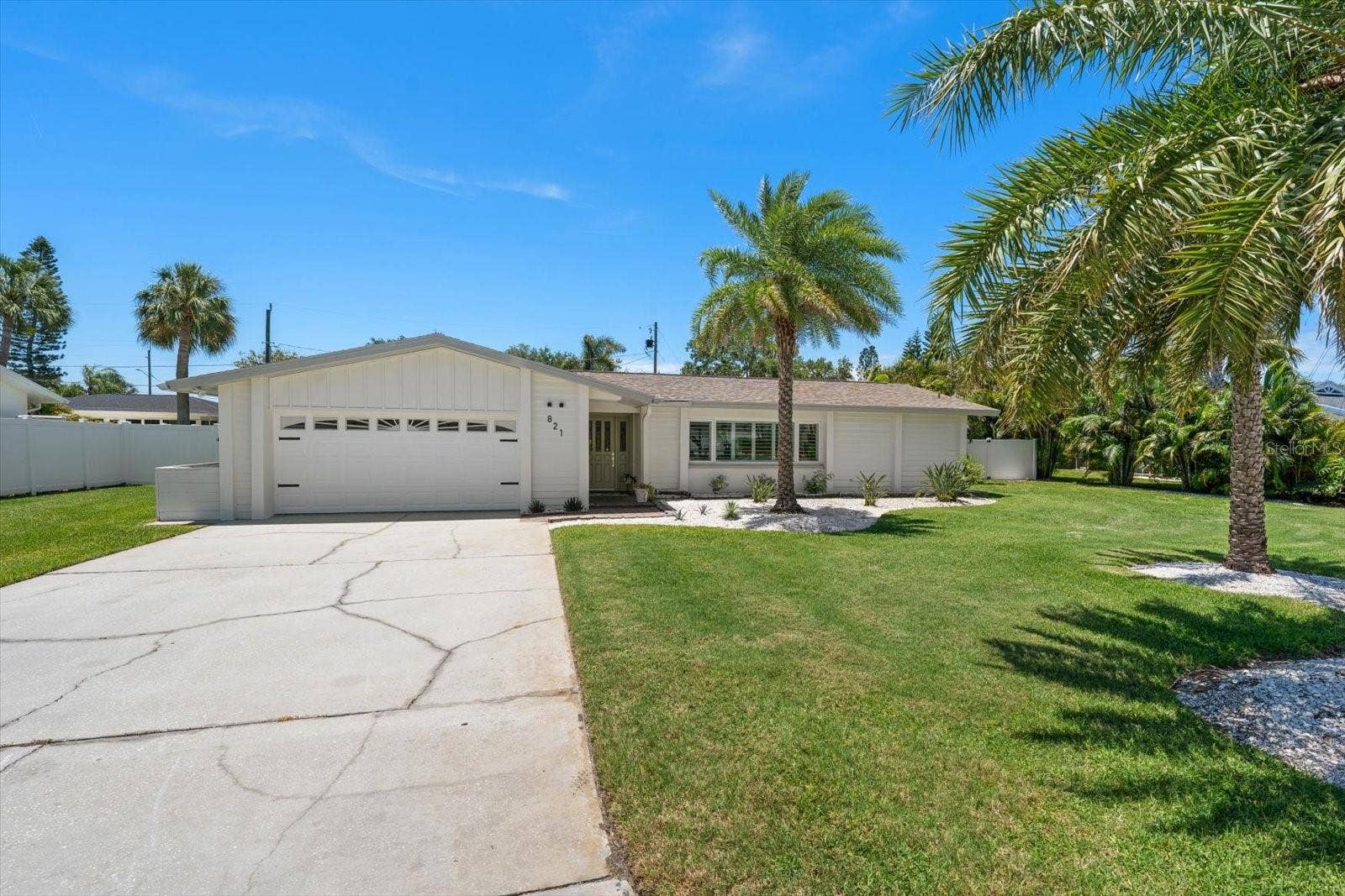 Large driveway, and lawns just waiting for someone to play on.